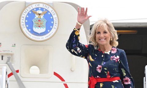 US First Lady Jill Biden waves as she walks off the plane as she arrives in Savannah, Georgia on July 8, 2021.
