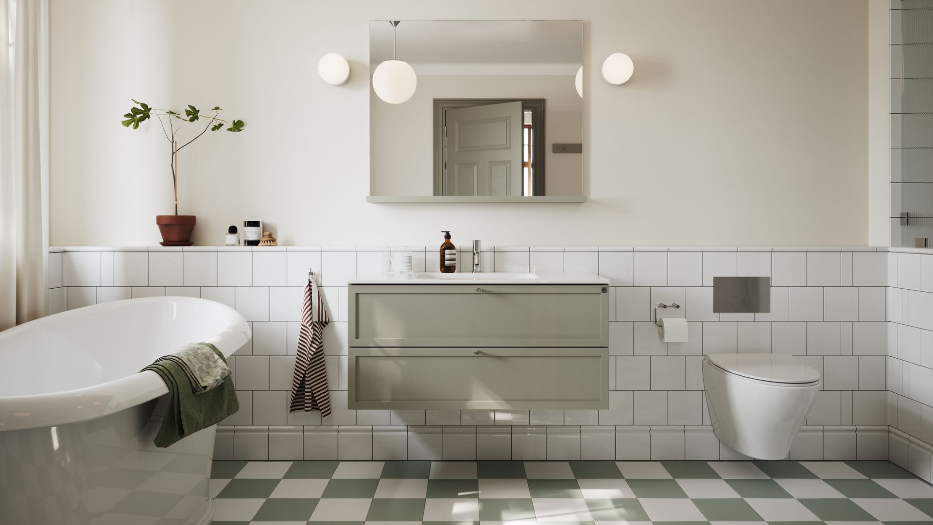Baño con bañera con zócalo alto de azulejos blancos, mueble verde suspendido, bañera exenta, suelo de baldosas blancas y verdes, espejo, apliques redondos a ambos lados del espejo