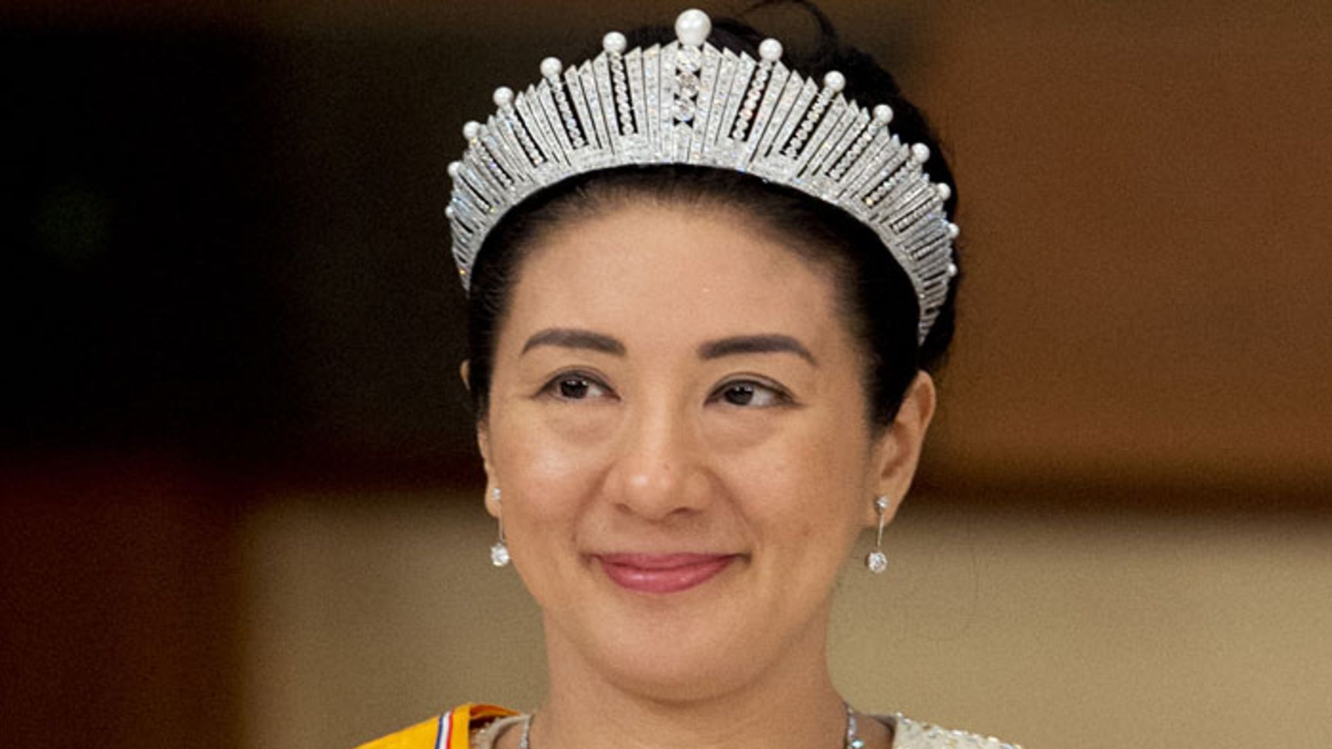Japans new Empress Masako waves as she leaves the Imperial Palace in Tokyo on May 1, 2019. - Japan's new Emperor Naruhito formally ascended the Chrysanthemum Throne on May 1, a day after his father's historic abdication, and vowed to stand with the people as the country begins a new imperial era. (Photo by Toshifumi KITAMURA / AFP) (Photo credit should read TOSHIFUMI KITAMURA/AFP via Getty Images)
