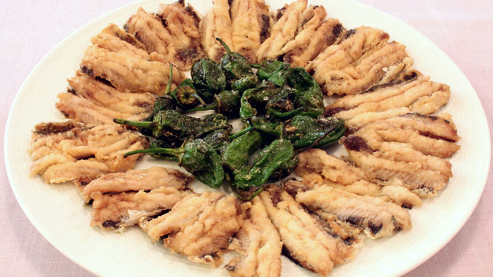 'Xoubas' con pimientos de padrón