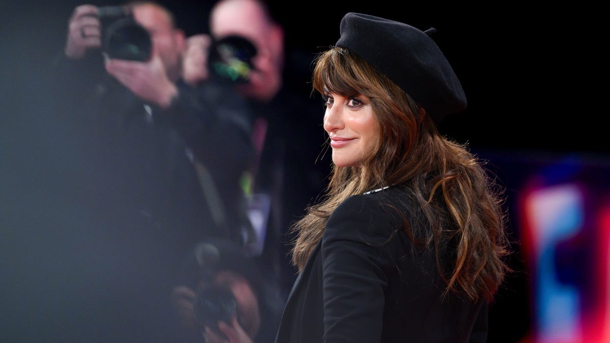Penélope Cruz wears a patterned tie to the London Film Festival