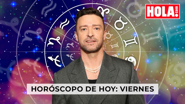 Justin Timberlake en primer plano, de fondo la rueda del Zodiaco