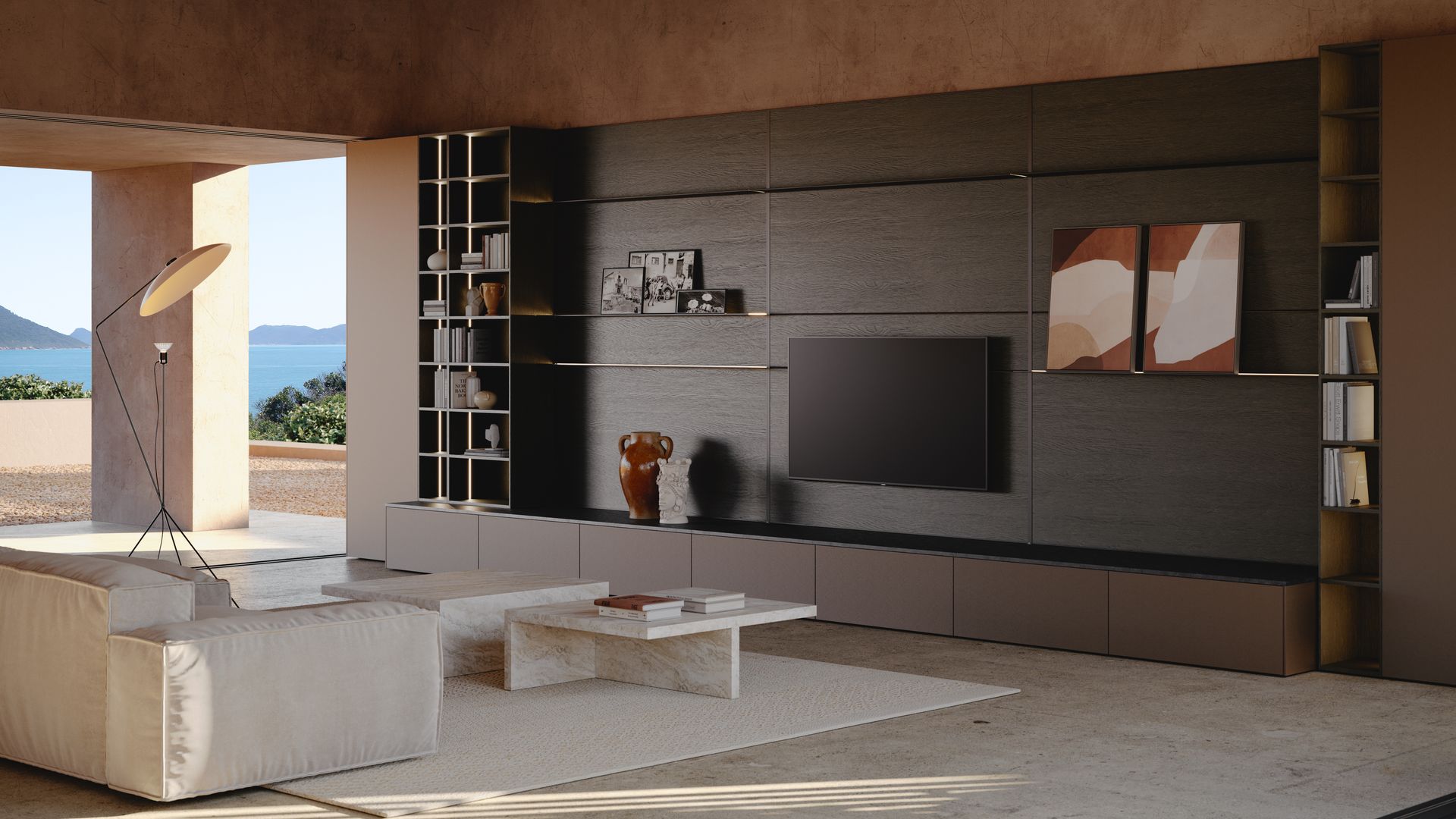 Salón con mueble modular en madera oscura de donde cuelga la televisión, baldas, cajones en la parte inferior, sofá blanco, mesa de centro de mármol y alfombra blanca