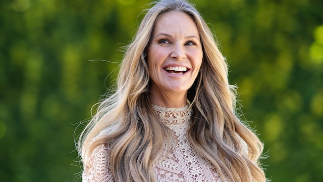 PARIS, FRANCE - JULY 04: Elle Macpherson wears a beige lace pattern high neck / long sleeves body, a matching beige pleated midi skirt, black sunglasses, outside the Dior show, during Paris Fashion Week - Haute Couture Fall Winter 2022 2023, on July 04, 2022 in Paris, France. (Photo by Edward Berthelot/Getty Images)
