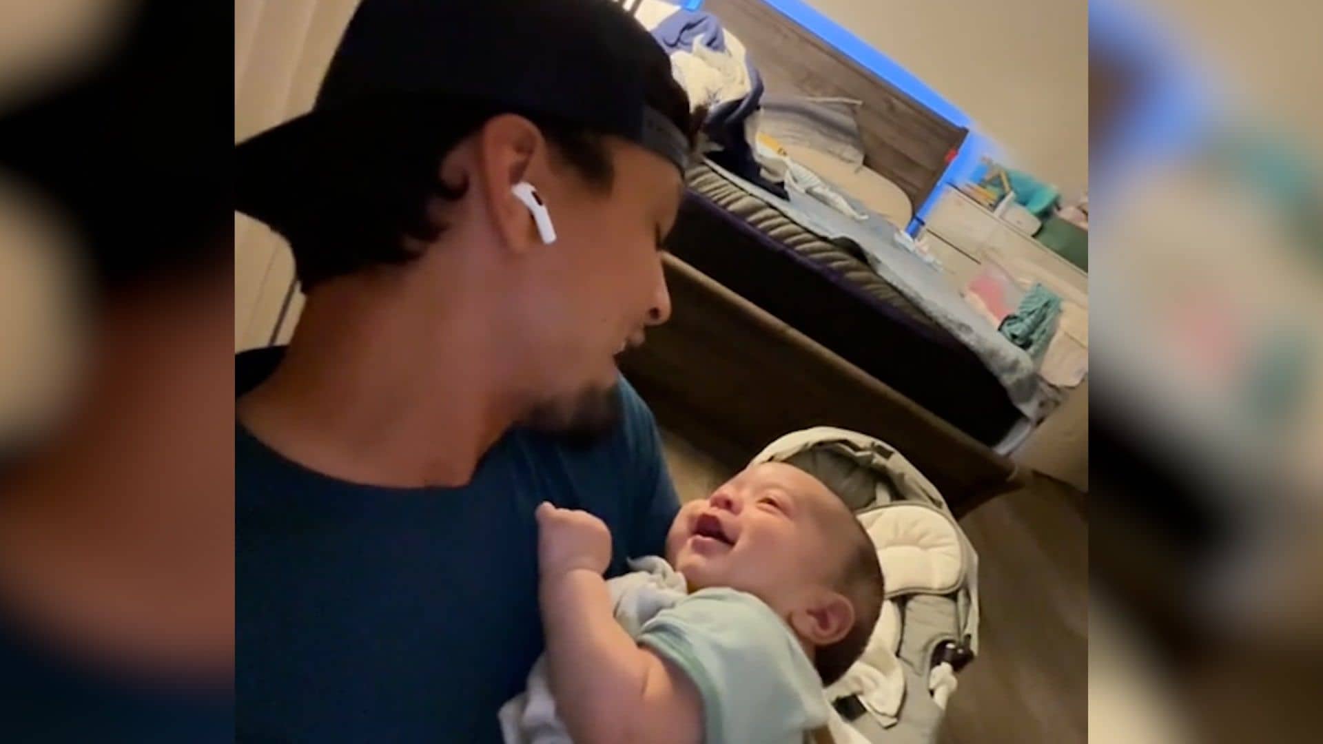 La emotiva reacción de un bebe cuando su padre le canta mientras le acuna en brazos: el vídeo que enamora en redes