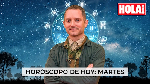 Elijah Wood en primer plano, de fondo la rueda del Zodiaco