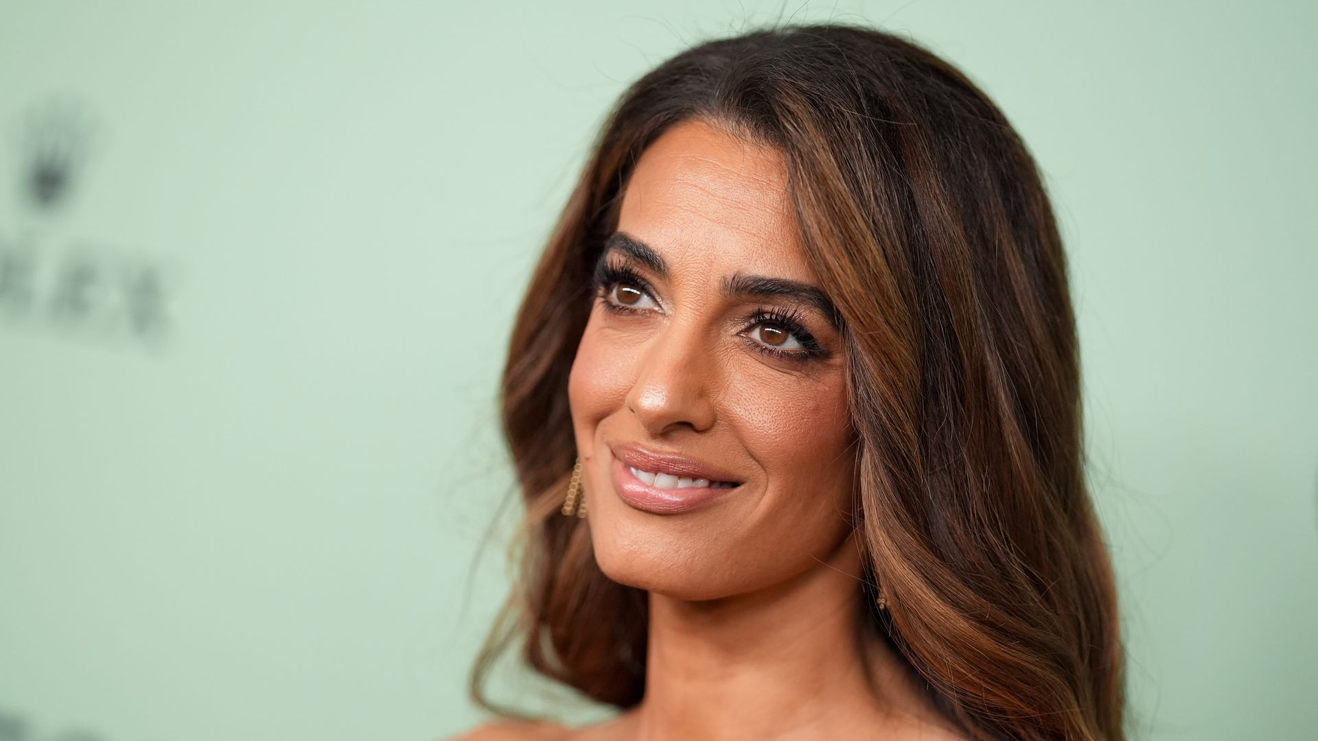 Amal Clooney makes glamorous red carpet return and shares tender moment with George