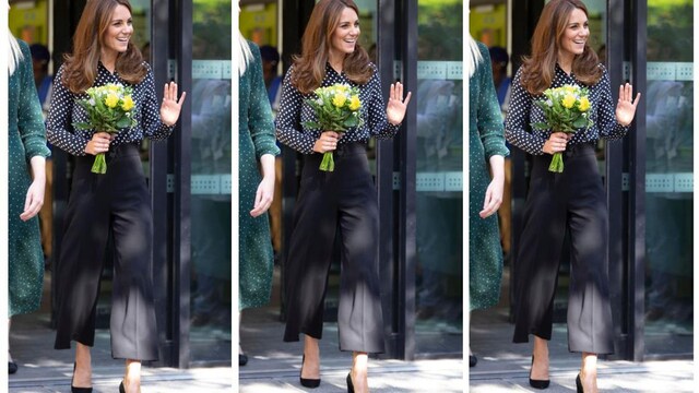 kate middleton en un look de pantalones culotte negros y blusa con estampado de lunares