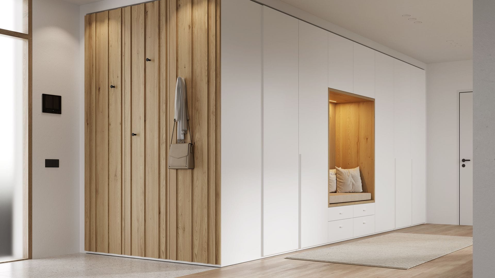 Recibidor con estructura a medida con armarios blancos, pared con colgadores, banco con luz, cojines y cajones inferiores 