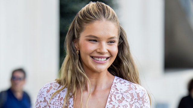 NEW YORK, NEW YORK - SEPTEMBER 10: A guest wears white laced dress outside Michael Kors during New York Fashion Week on September 10, 2024 in New York City. (Photo by Christian Vierig/Getty Images)