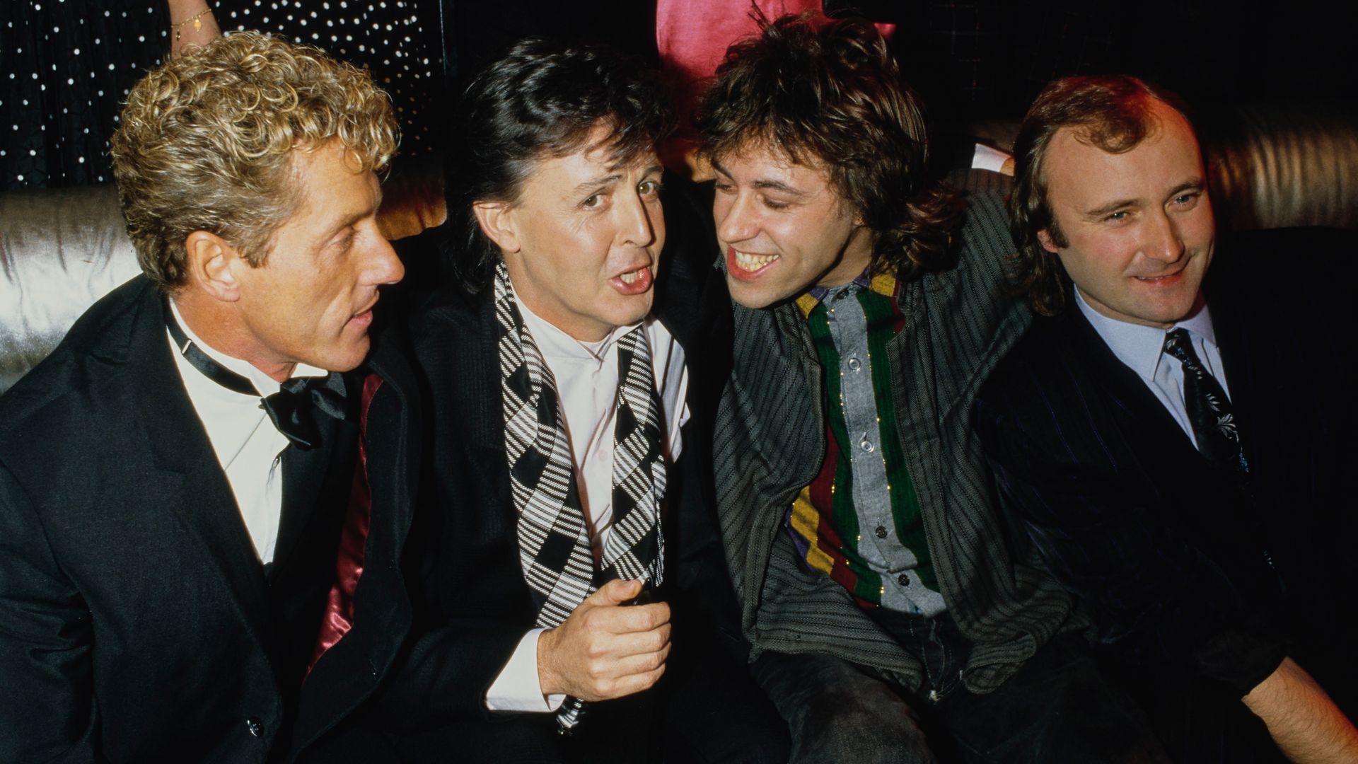 Roger Daltrey, Paul McCartney, Bob Geldof y Phil Collins durante una celebración en 1986