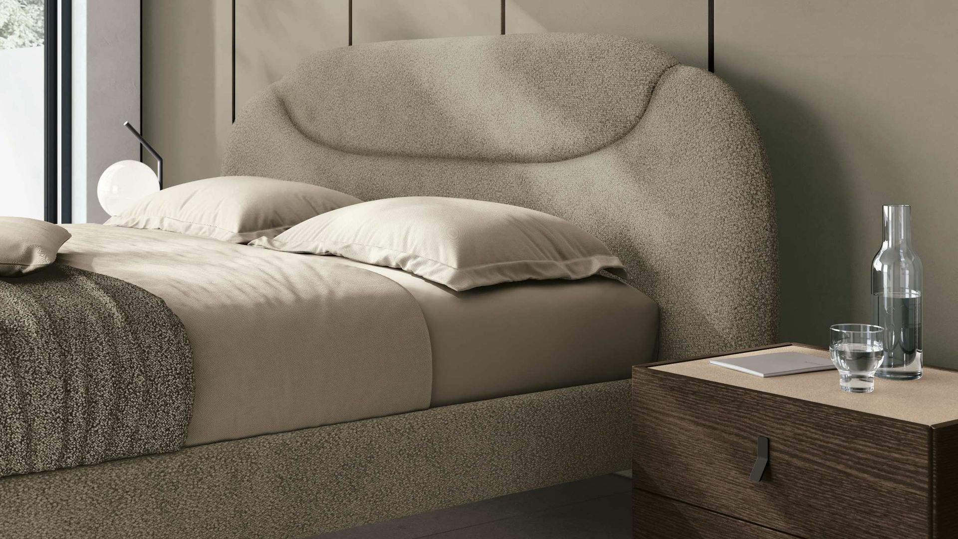 Dormitorio con cabecero tapizado de formas curvas y color gris