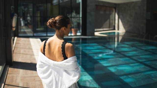 Female healthy lifestyle, leisure and relaxation on poolside. Beauty treatment in spa center, body care, pool after sauna. Travel and vacations.
