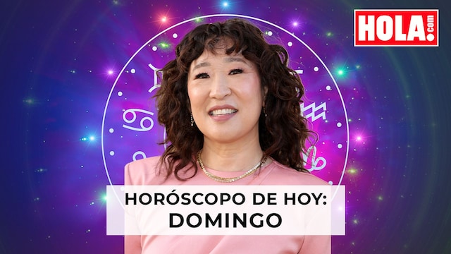 Sandra Oh con la rueda del zodiaco detrás 