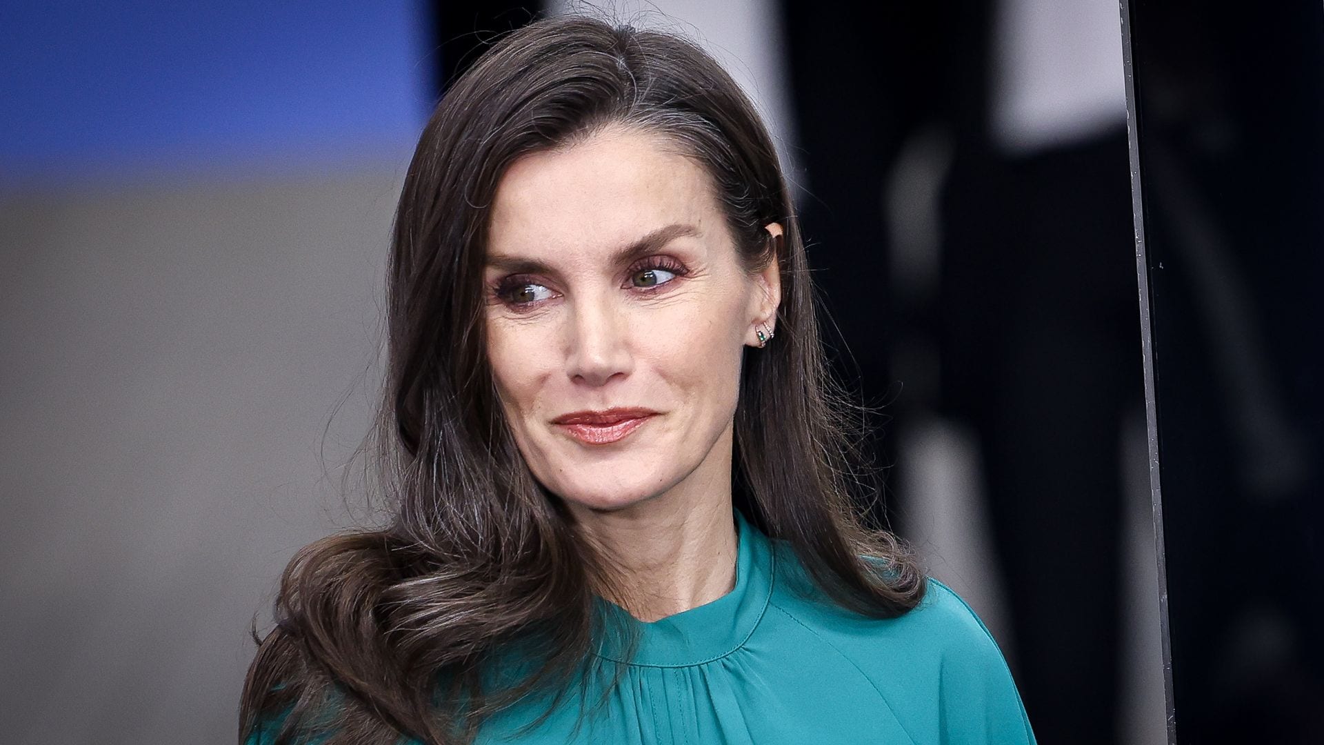Queen Letizia gives her classic black dress a modern twist with one bold accessory