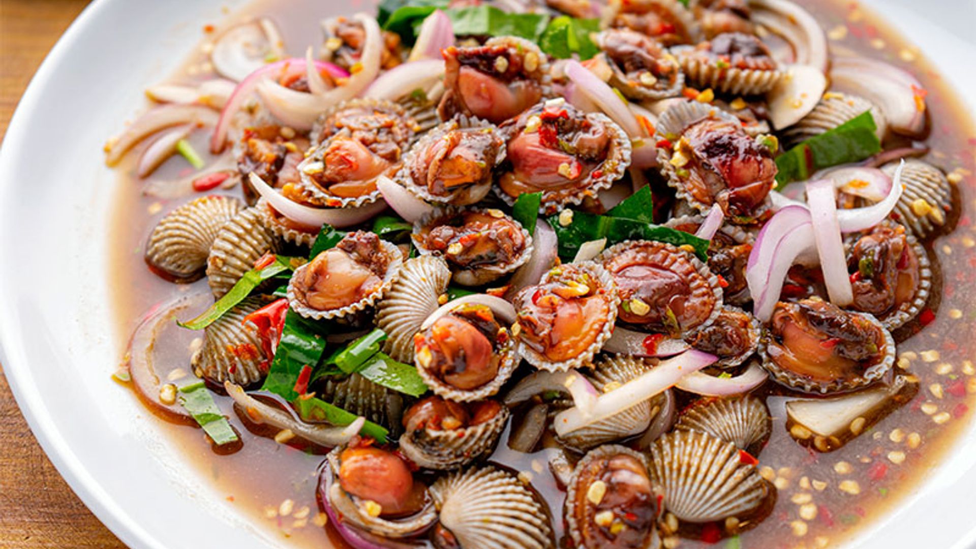 Berberechos marinados con salsa 'thai'
