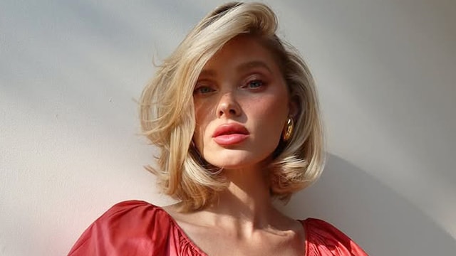 Elsa Hosk con vestido coral y corte mariposa rubio