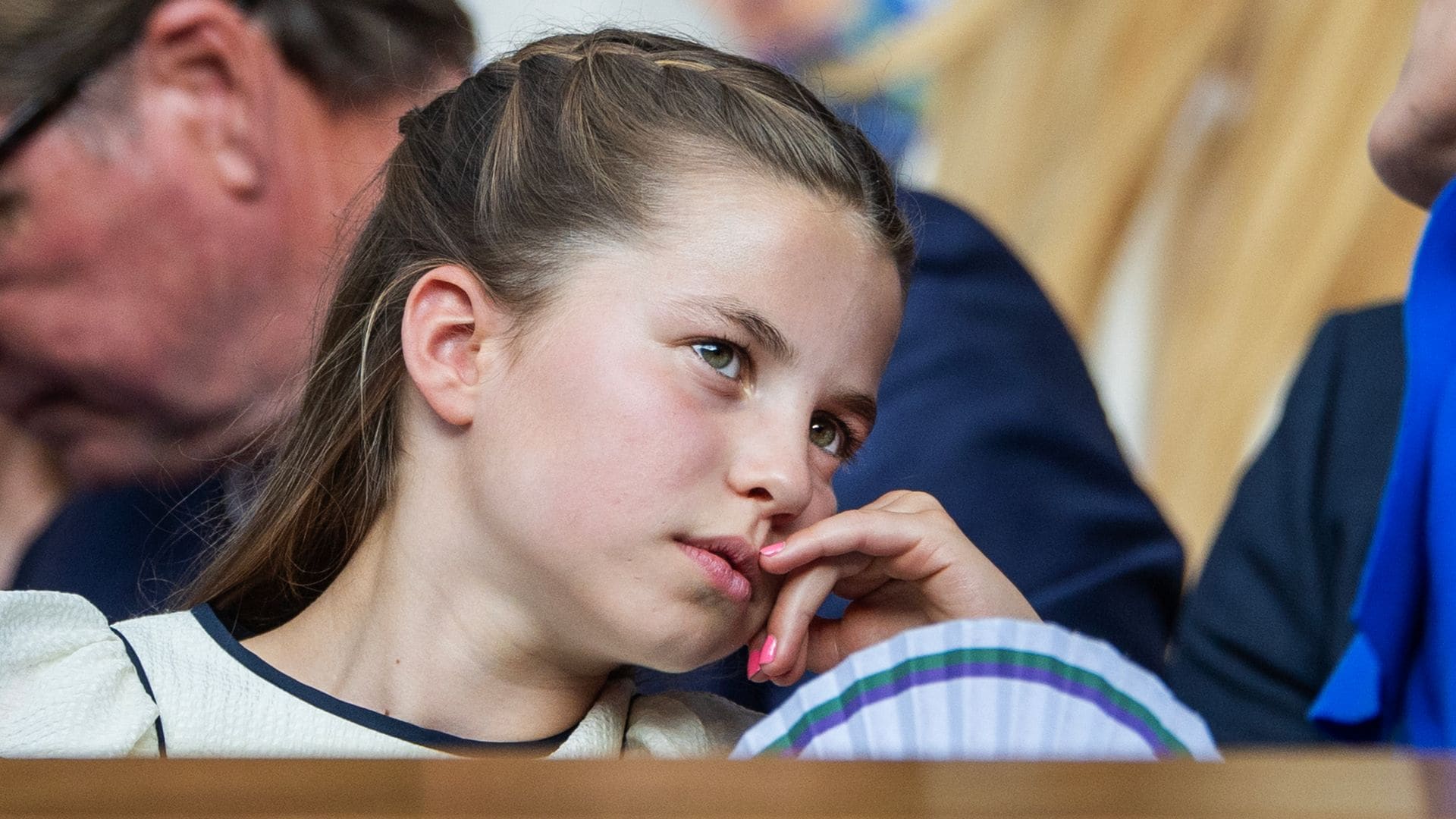 Princess Charlotte of Wales, with her finger nails painted pink, in the Royal Box for the Gentlemen's Singles Final on Centre Court during the Wimbledon Lawn Tennis Championships at the All England Lawn Tennis and Croquet Club at Wimbledon on July 13th, 2025, in London, England. (Photo by Tim Clayton/Getty Images)