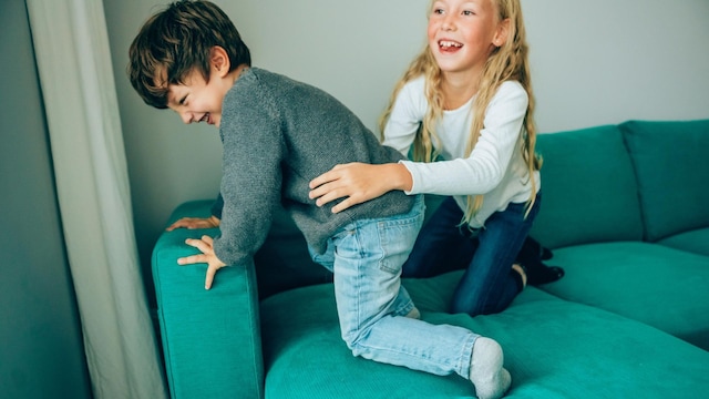 little children playing on the sofa