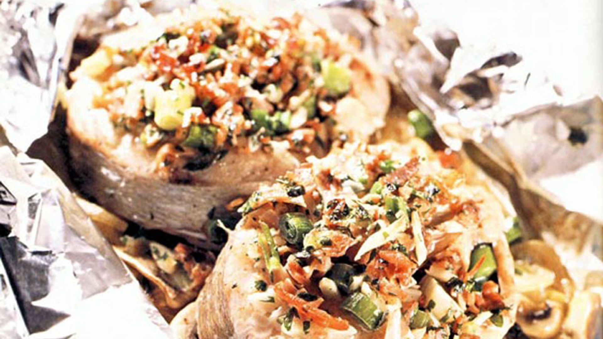 Merluza en papillote con jamón serrano