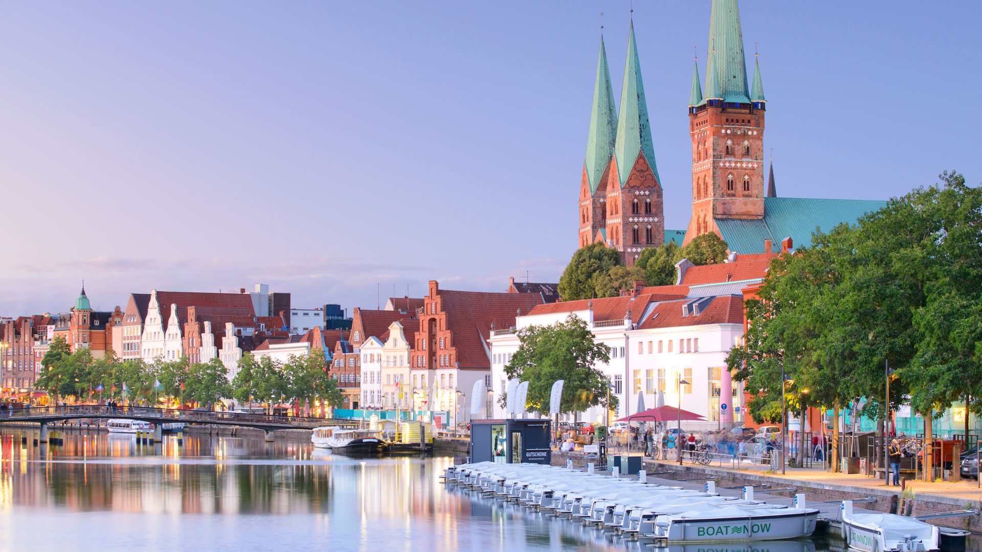 Lübeck, Schloswig-Holstein, Deutschland - View of Lübeck old town across the Trave river.