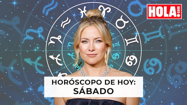 Kate Hudson en primer plano, de fondo, la rueda del zodiaco
