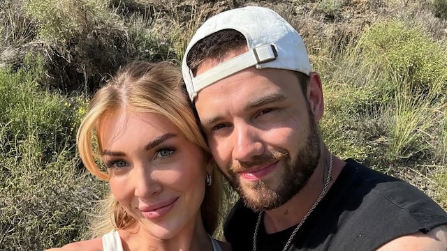 Plano medio de Kate Cassidy junto a Liam Payne en el campo