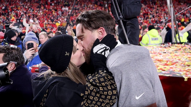 KANSAS CITY, MISSOURI - JANUARY 26: Taylor Swift kisses Travis Kelce #87 of the Kansas City Chiefs after defeating the Buffalo Bills 32-29 in the AFC Championship Game at GEHA Field at Arrowhead Stadium on January 26, 2025 in Kansas City, Missouri.  (Photo by Jamie Squire/Getty Images)