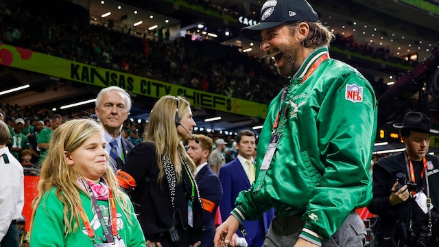 Bradley Cooper and daughter Lea wear matching Philadelphia Eagles jackets on the sideline before the team faces the Kansas City Chiefs during Super Bowl LIX at Caesars Superdome in New Orleans on Sunday, February 9, 2025