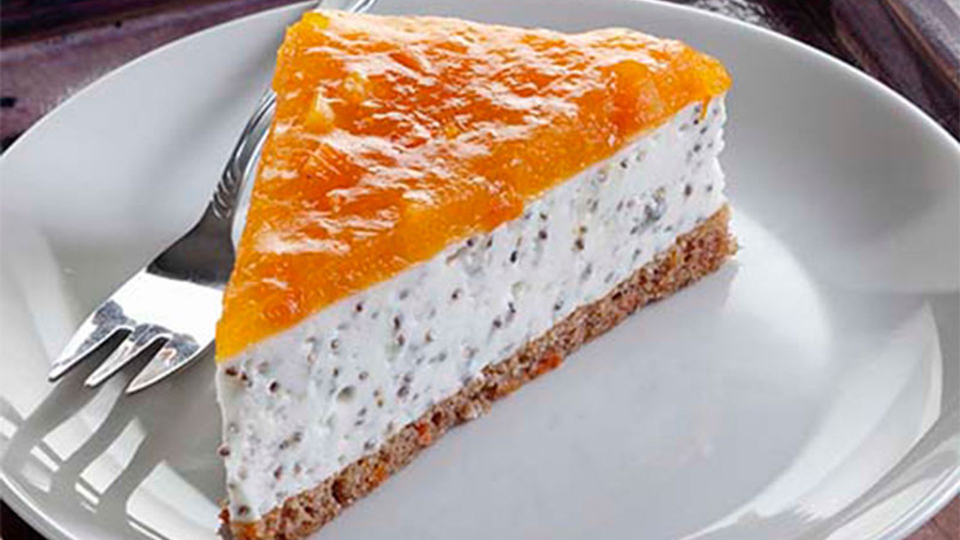 Tarta de queso, naranja y semillas de amapola
