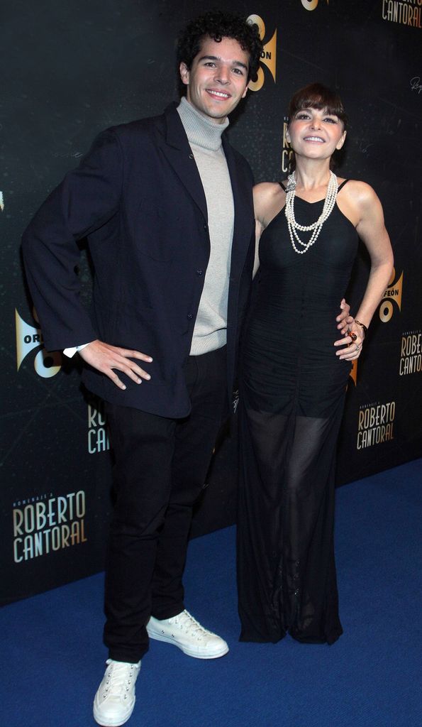 MEXICO CITY, MEXICO - NOVEMBER 10: Eduardo Santamarina Cantoral and his mother Itati Cantoral pose for a photo before entering the press conference for the Roberto Cantoral tribute album at El Cantoral on November 10, 2025 in Mexico City, Mexico. (Photo by Medios y Media/Getty Images)