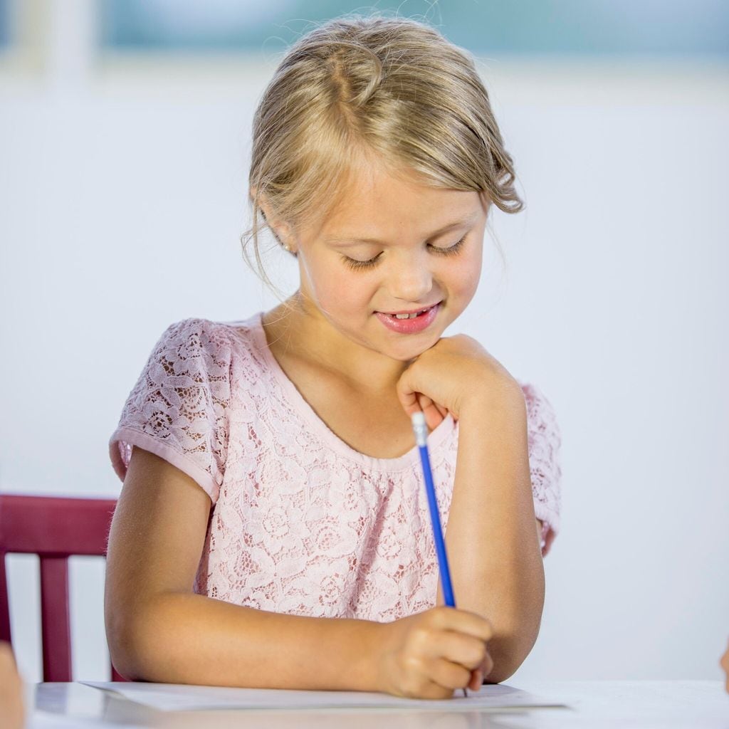 little girl practicing handwriting
