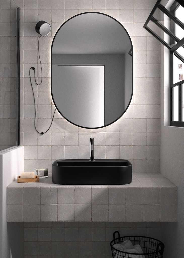 Lavabo negro mate con una pequeña repisa superior 