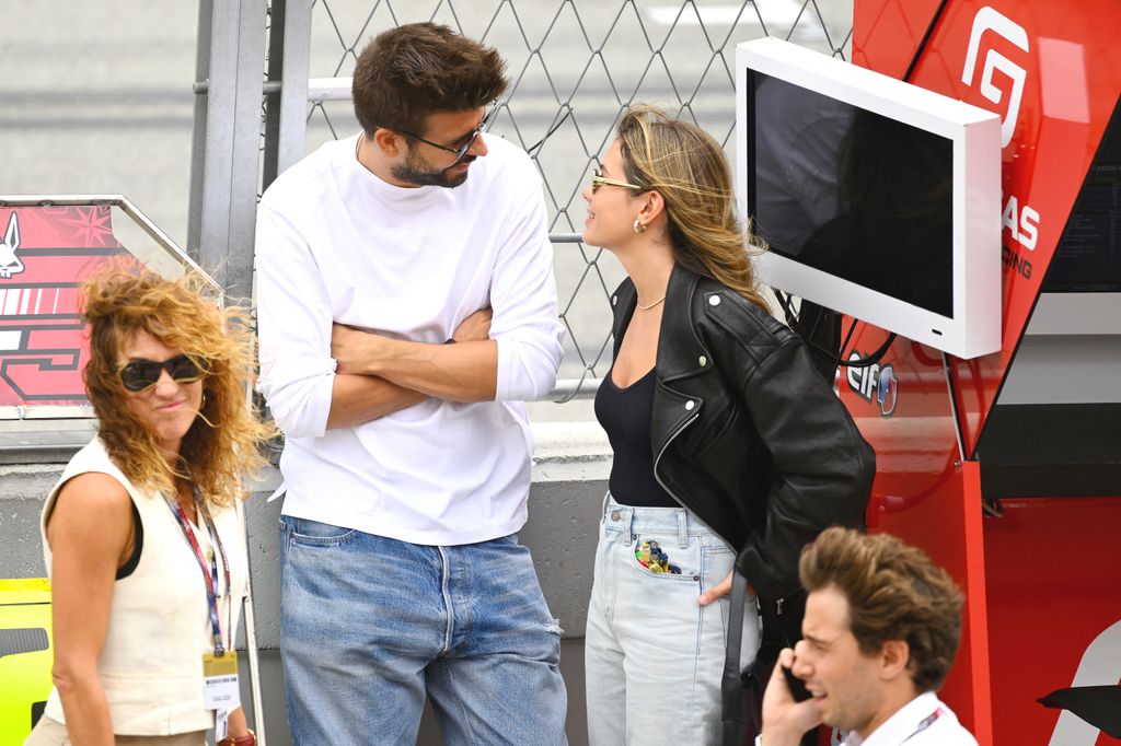 Former Barcelona's Spanish defender Gerard Pique (C) and his partner Clara Chia Marti (R) attend the Moto2 race of the Moto Grand Prix de Catalunya at the Circuit de Catalunya in Montmelo, on the outskirts of Barcelona, on September 3, 2023. (Photo by Josep LAGO / AFP) (Photo by JOSEP LAGO/AFP via Getty Images)