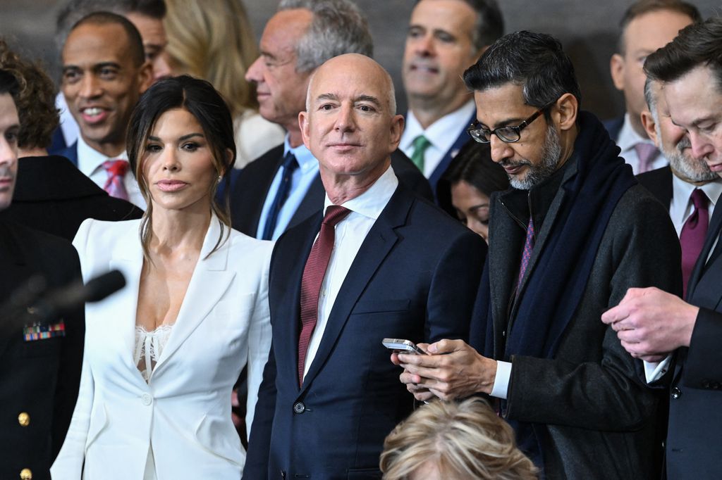 (L-R) Lauren Sanchez, Amazon founder Jeff Bezos, Google CEO Sundar Pichai and Tesla and SpaceX CEO Elon Musk attend the inauguration ceremony before Donald Trump is sworn in as the 47th US President in the US Capitol Rotunda in Washington, DC, on January 20, 2025. (Photo by SAUL LOEB / POOL / AFP) (Photo by SAUL LOEB/POOL/AFP via Getty Images)