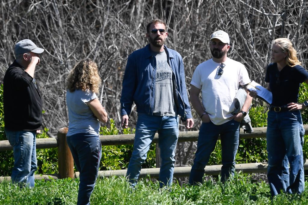 04/06/2025 Ben Affleck is spotted out scouting film locations in Los Angeles. The 52 year old American actor was dressed casually in blue jacket paired with denim jeans as he strolled an open field with a film production crew