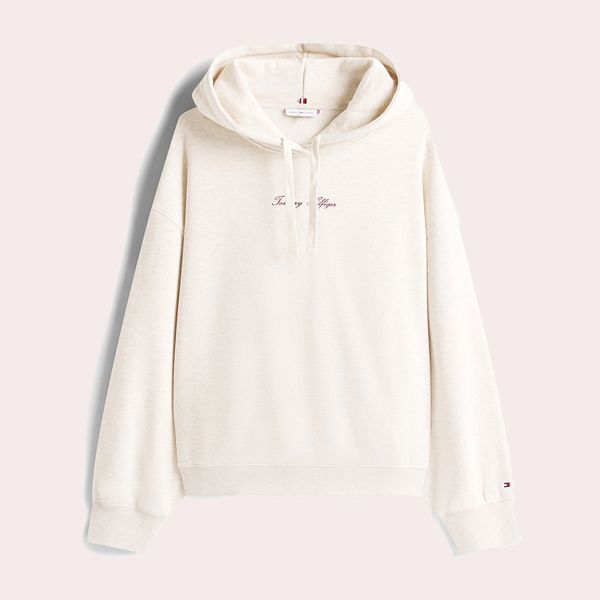 Sudadera de mujer con capucha y logo engomado