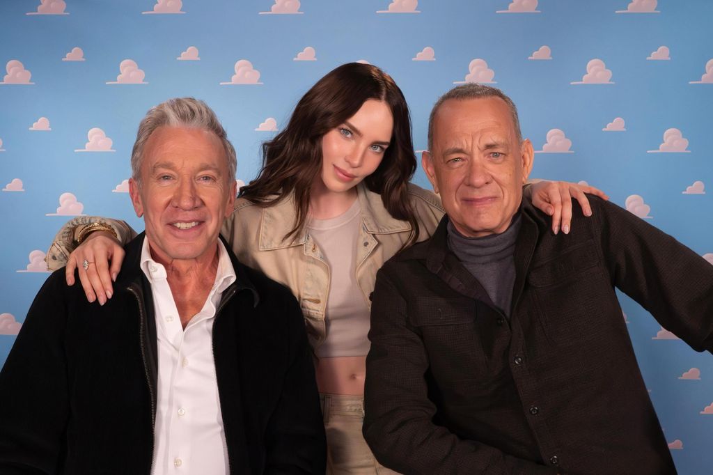 Belinda con Tim Allen y Tom Hanks, los actores que hacen las voces de Woody y Buzz Lightyear.