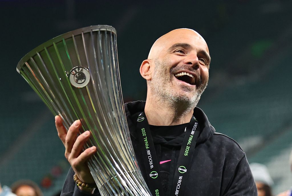 WROCLAW, POLAND - MAY 28: Enzo Maresca manager / head coach of Chelsea celebrates with the trophy after winning the UEFA Conference League Final 2025 between Real Betis Balompie and Chelsea FC at Wrocaw Stadium on May 28, 2025 in Wroclaw, Poland. (Photo by Robbie Jay Barratt - AMA/Getty Images)