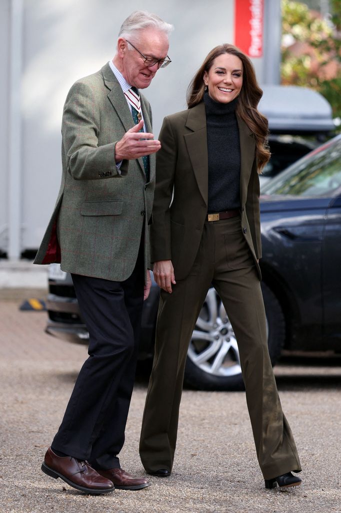 Britain's Catherine (R), Princess of Wales, walks with Lord-Lieutenant of Suffolk Mark Pendlington (L) during a visit to The Treehouse children's hospice to learn about the care and support provided by East Anglia's Children's Hospices (EACH), in Ipswich, eastern England on October 22, 2026. East Anglia's Children's Hospices (EACH) deliver lifelong care to children with life-limiting conditions and their families