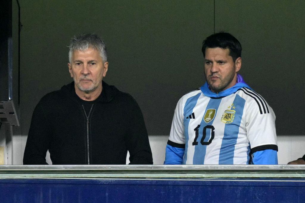 Argentina's forward Lionel Messi's father, Jorge Messi (L), and brother Rodrigo wait for the start of the 2026 FIFA World Cup South American qualifiers football match between Argentina and Peru at the La Bombonera stadium in Buenos Aires on November 19, 2024. (Photo by JUAN MABROMATA / AFP via Getty Images)