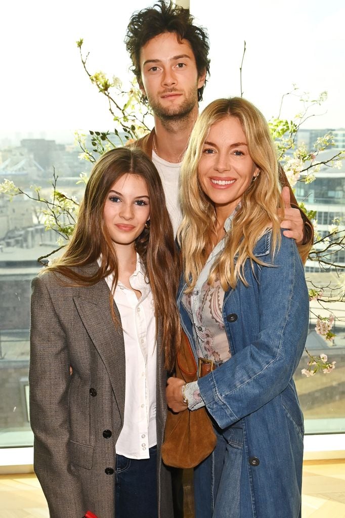 LONDON, ENGLAND - APRIL 01: (L to R) Marlowe Sturridge, Oli Green and Sienna Miller attend Savannah Miller's Bridal Ballerina Breakfast at Four Seasons Tower Bridge on April 1, 2025 in London, England. (Photo by Dave Benett/Getty Images for Savannah Miller Bridal)