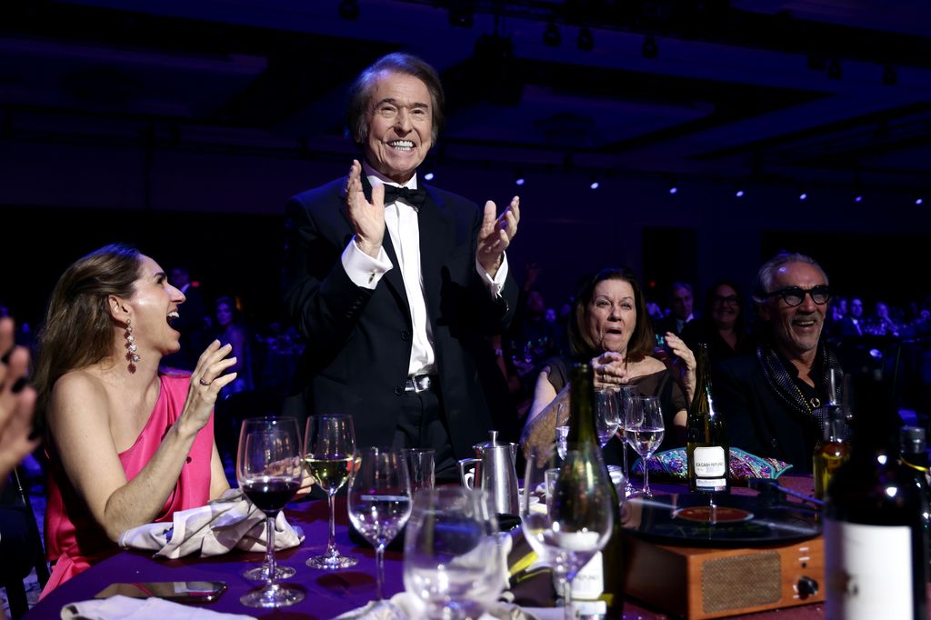 Raphael con su mujer e hija durante la gala