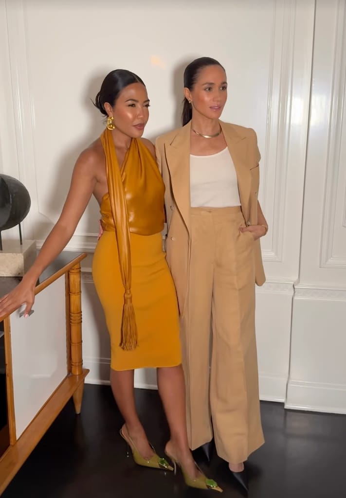 Meghan y Emma se muestan amigables en el evento.