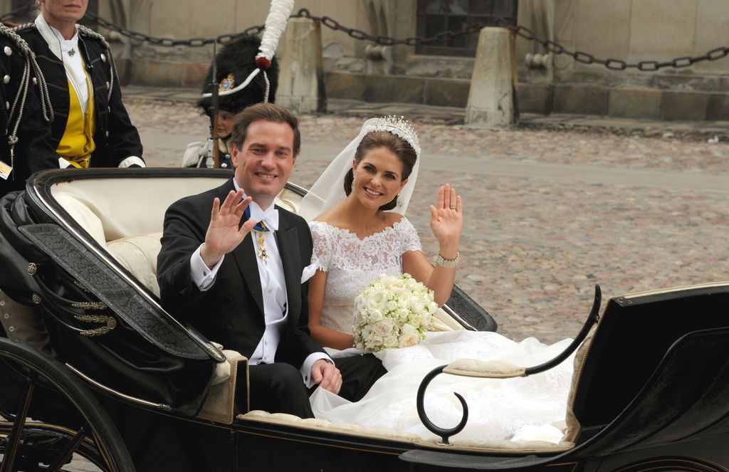 Swedish Princess Madeleine and her husband Chris O'Neill drive in a carriage from the Royal Palace to Riddarholmen after their wedding in Stockholm, Sweden, 08 June 2013. Photo: Carsten Rehder/dpa | usage worldwide   (Photo by Carsten Rehder/picture alliance via Getty Images)