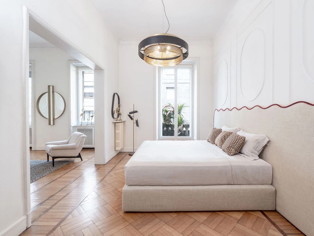Dormitorio con cabecero en forma de ondas