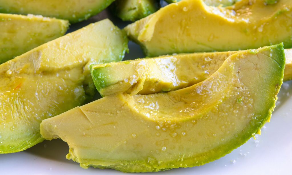 Slices of Hass Avocado. Close up of healthy vegetarian food