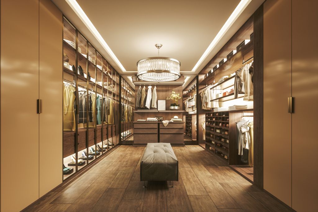 Ideas de vestidores exclusivos donde la madera y el diseño de lujo son las grandes protagonistas del orden