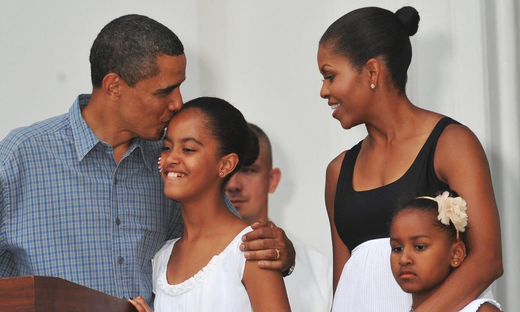 us president barack obama kisses his dau