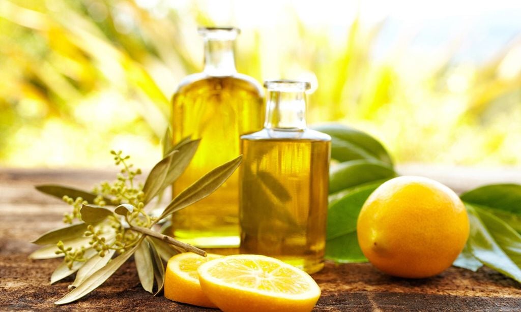 Massage oil bottles with lemons and olive branch